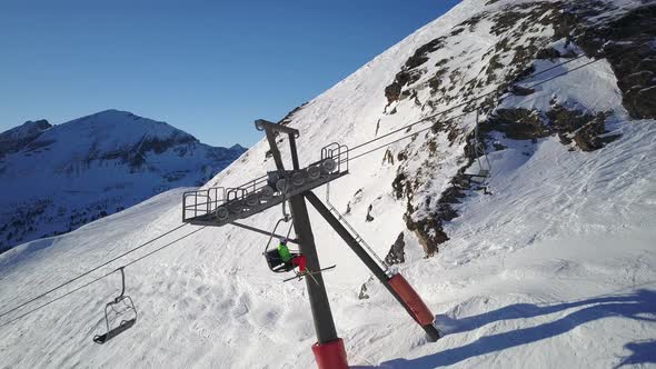 Aerial View One Skier Going Up on Chair Lift