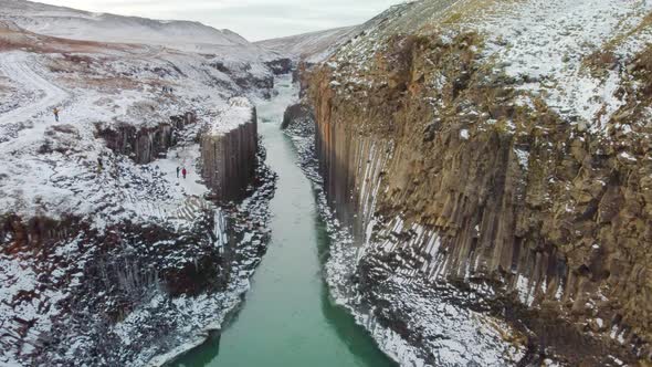 Beautiful cinematic aerial view of the studlagil canyon, and the largest number of basalt rock colum