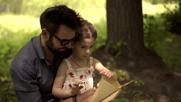 Father's Day. Single Parent Dad Teach Preschool Child Girl. Kid With Father Reading Book.