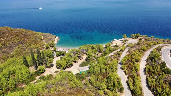 Peaceful Beach Shore with Tourists in Summer Vacations Mediterranean Sea Spetses Greece