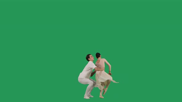 Professional Ballet Pair Practicing Moves on Green Screen