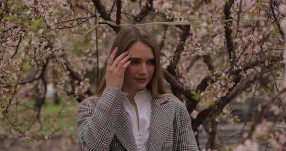 Portrait of Woman Near Blossom Tree