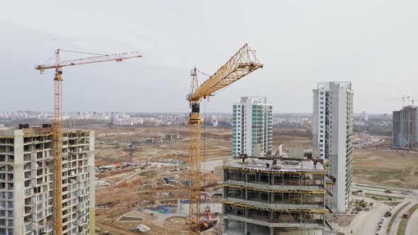 Aerial View Construction with High Tower Cranes Working on Building Site in Big City