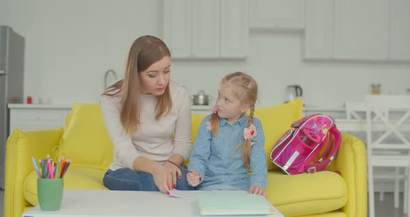 Smart Schoolgirl with Mum Studying at Home