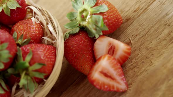 Fresh strawberries in wicker bowl