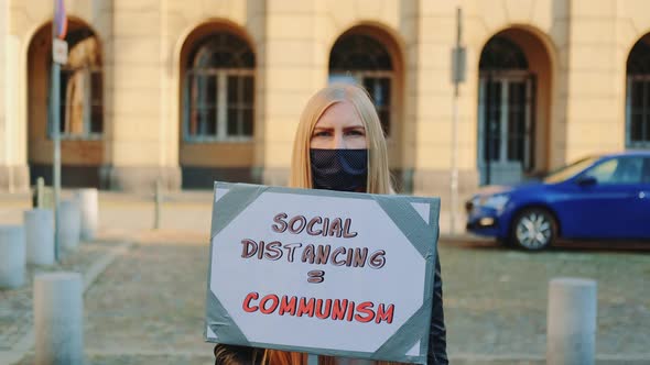 Woman's Protest Walk with Steamer Against Social Distancing That Equals Communism