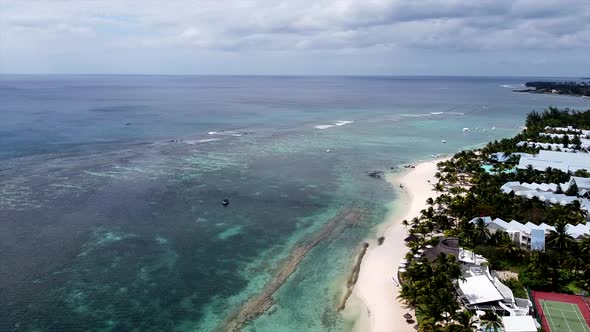 Flying over mauritian seaside beach promenade and indian ocean,mauritius