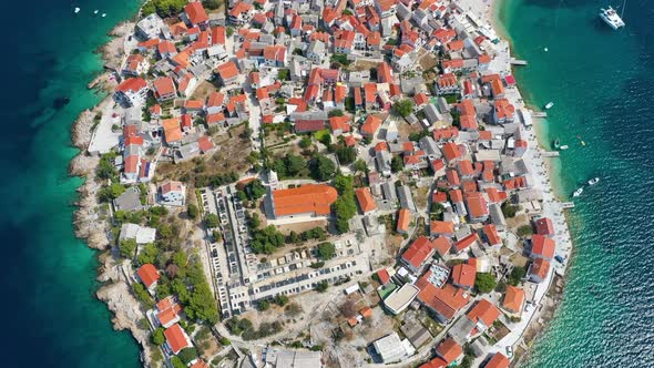 Primosten town, Croatia. View of the city from the air. Seascape with beach and old town.