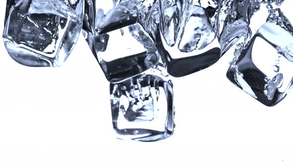 Super Slow Motion Shot of Ice Cubes Falling Into Water at 1000Fps