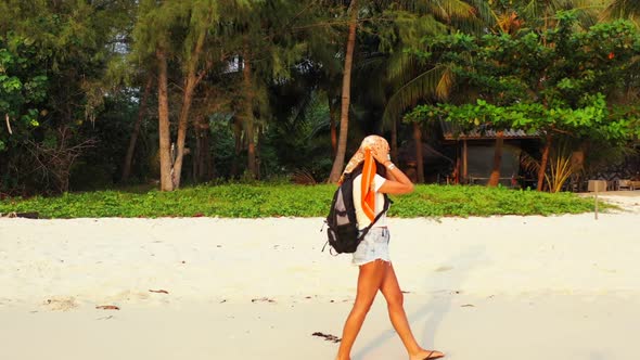 Ladies best friends on paradise tourist beach adventure by blue sea with white sandy background of T