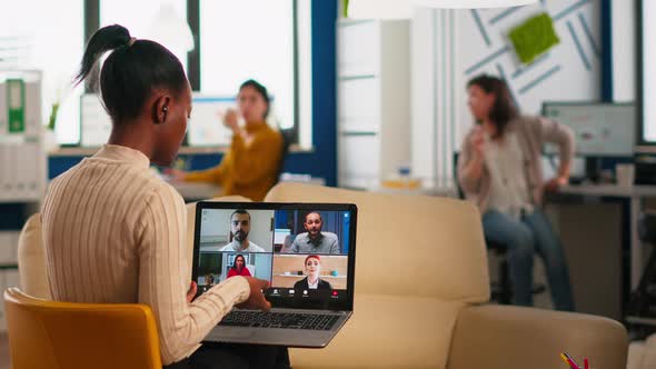 African Manager Woman Discussing with Remote Colleagues Using Video Call