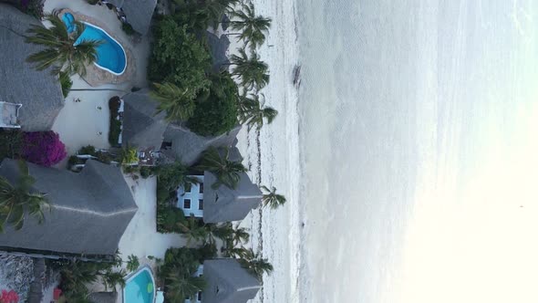 Vertical Video of the Ocean Near the Coast of Zanzibar Tanzania Aerial View