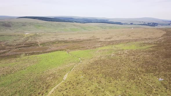 Flying over tors in Dartmoor National Park, England.