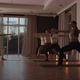 A Group of Women is Engaged in Stretching and Balance with an Instructor in a Beautiful Hall with - VideoHive Item for Sale