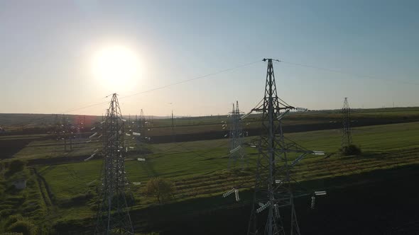 Aerial View of High Voltage Power Lines at Sunset
