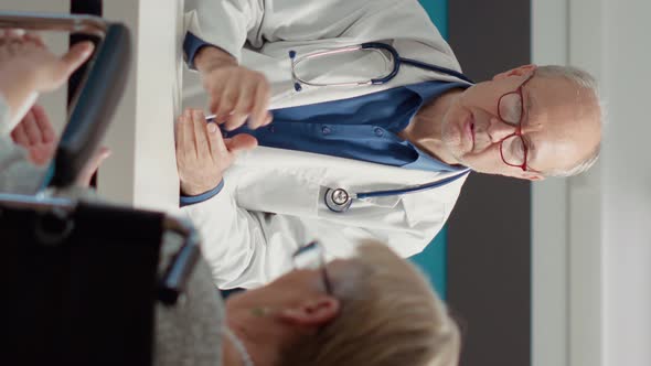 Vertical Video Health Specialist Having Conversation with Female Wheelchair User