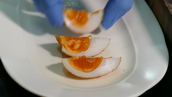 Close-up Footage of Whole Deep Fried Egg with Juicy Yolk Displaying on the White Plate