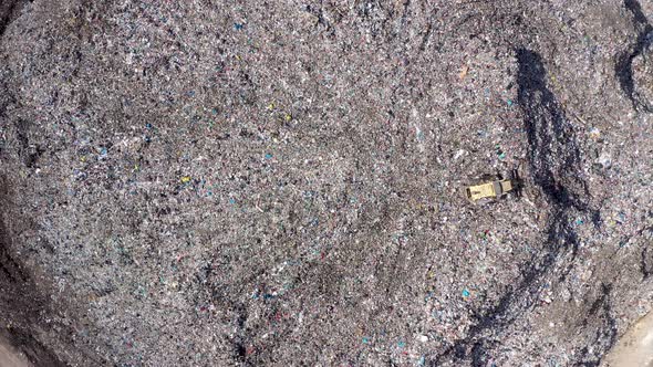 Bulldozer Working on a Garbage Dump