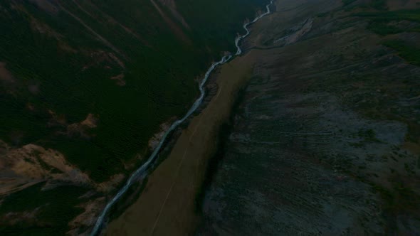 Aerial Top Shot View Dive to Mountain River and Herd of Horses