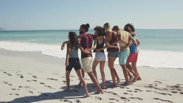 Friends walking seaside