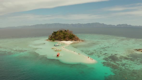 Small Torpic Island with a White Sandy Beach, Top View.