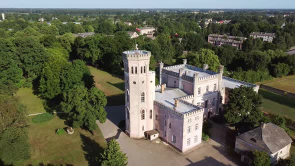 Vecauce Manor in Latvia Aerial View of the Pink Castle Through the Park. Vecauce Castle Tower With a