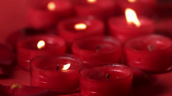 Red candles extinguished by a breeze