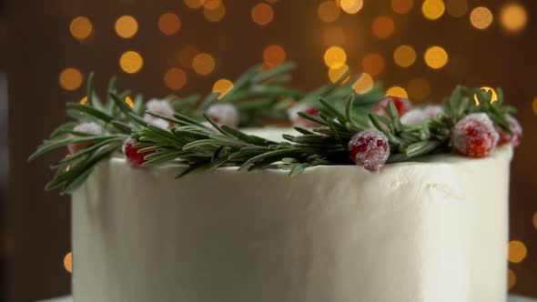 Panorama of Delicious Christmas White Cream Cake with Rosemary Wreath