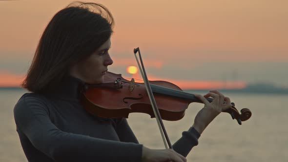 Woman Is Playing Inspired By Sunrise