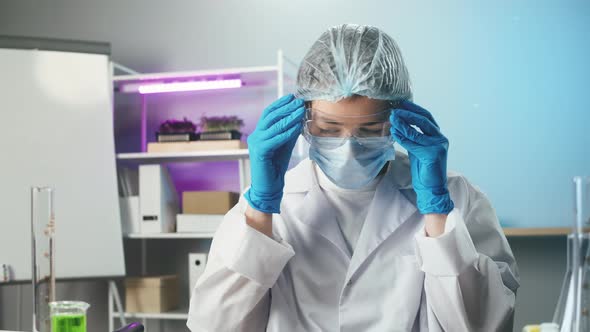 Medical Scientist Inspecting Minced Vegan Meat Wearing Protective Unform Working in Laboratory