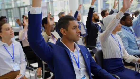 Multi ethnic business people raising hands in the business seminar 4k