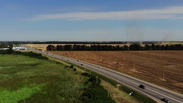 Aerial view of the road and wheat fields.
