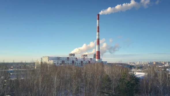 Aerial Motion Down From Heating Station To Winter Forest