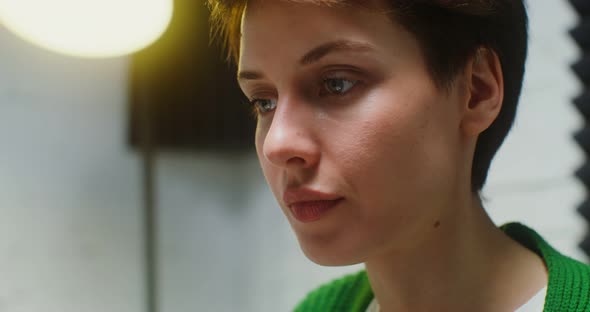 Side View of the Face of a Woman with a Concentrated Working at the Computer