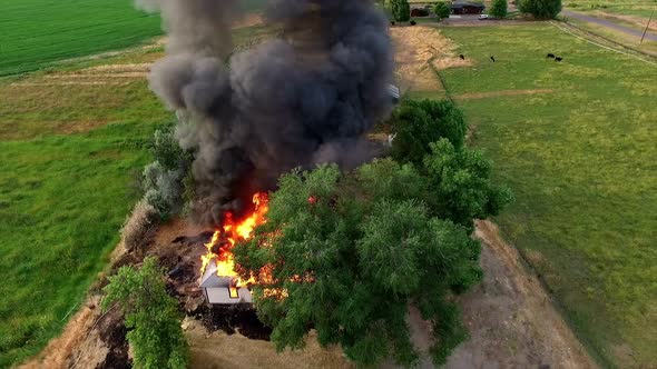 Aerial footage of house burning down