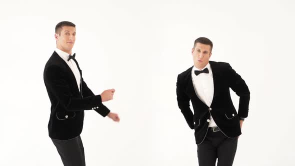 Two fun men in black suits. Parody of the dancers