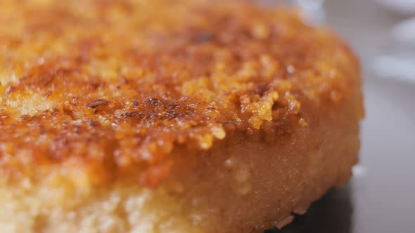 Cutlet Closeup in Golden Crispy Breading with Smooth Camera Movement