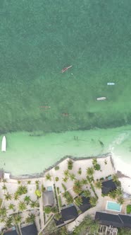 Vertical Video Boats in the Ocean Near the Coast of Zanzibar Tanzania