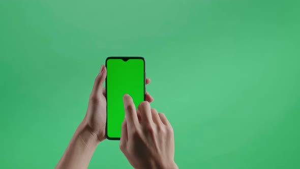 Hand Tap Touch Green Screen Smartphone On The Green Screen Background