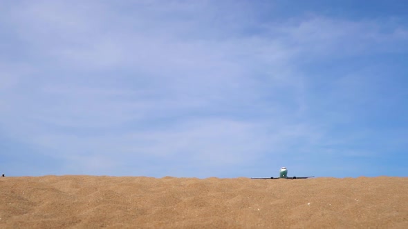 Superslowmotion Shot of a Tropical Beach Where Airplanes Fly Over Tourists Heads Before Land