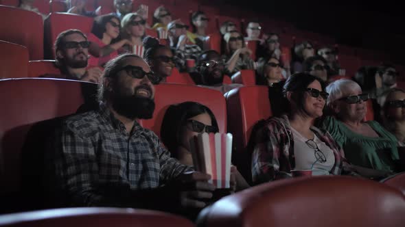 Mixed Race Family Watching 3d Movie in Cinema