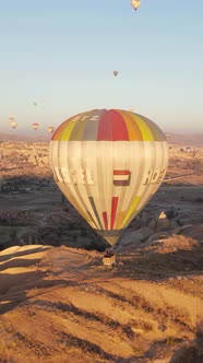 Vertical Video of Hot Air Balloons Flying in the Sky Over Cappadocia Turkey