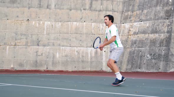 Active man playing tennis