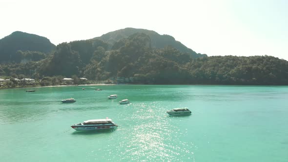 Motorboats against tropical Island bay. Ko Phi Phi Islands