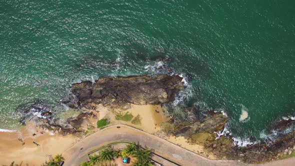 Aerial view of a car driving along the coast in Beruwala, Sri Lanka.