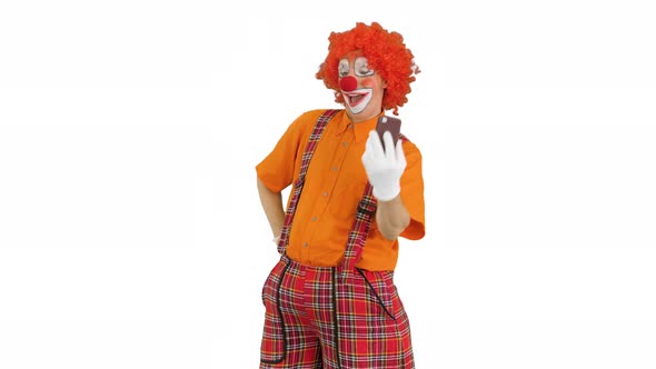 Clown Taking Selfie with His Phone on White Background