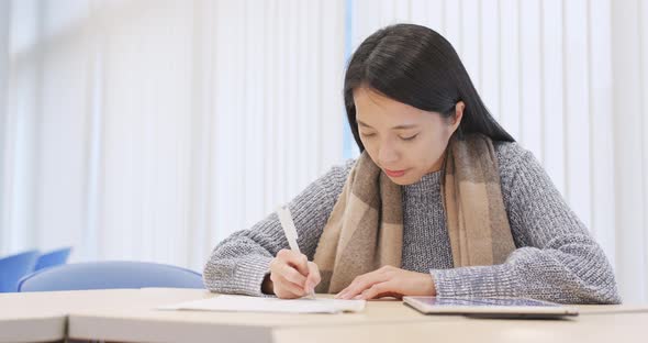 Student Doing Revision at Library