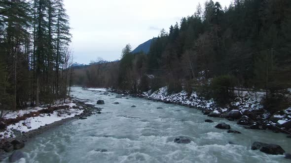 Aerial View of Chilliwack River with Snow During Winter Season