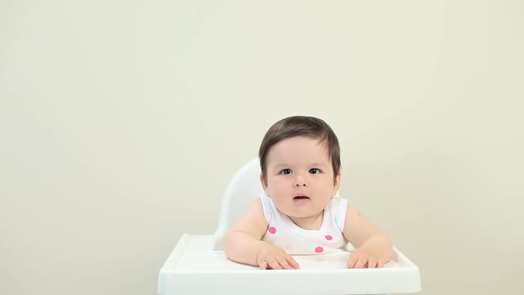 Baby boy sitting in highchair