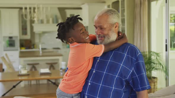 Grandfather and grandson embracing